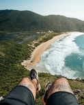 a person with their feet up looking at the ocean