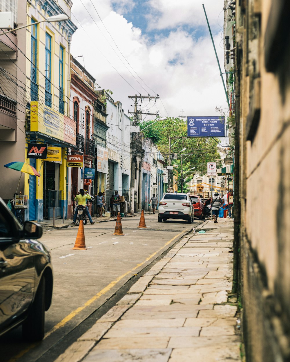 a city street with cars parked on the side of it