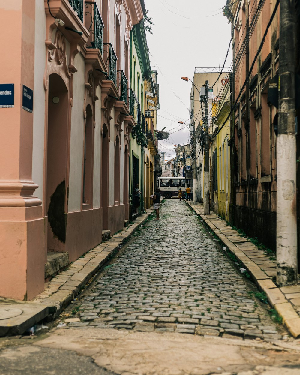 a narrow cobblestone street in a city