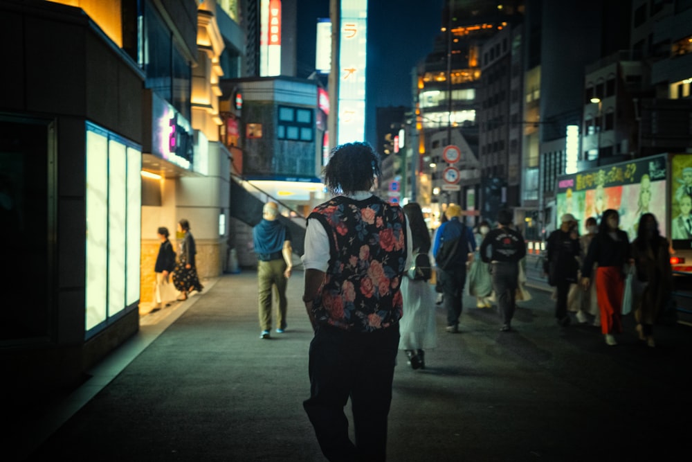 a group of people walking down the street