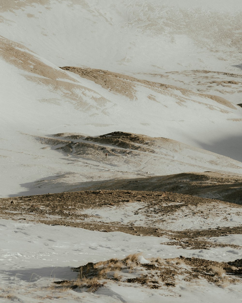 a man riding skis on top of a snow covered slope