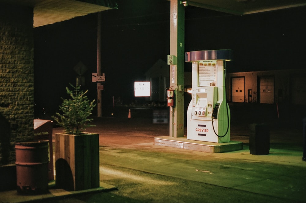a gas pump sitting on the side of a road