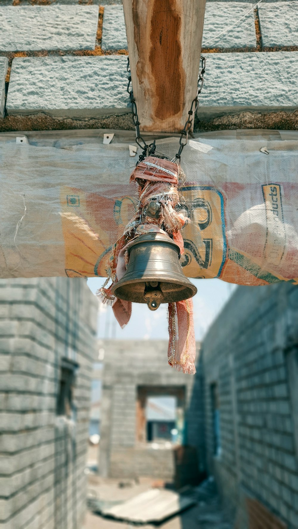 a bell hanging from the side of a building