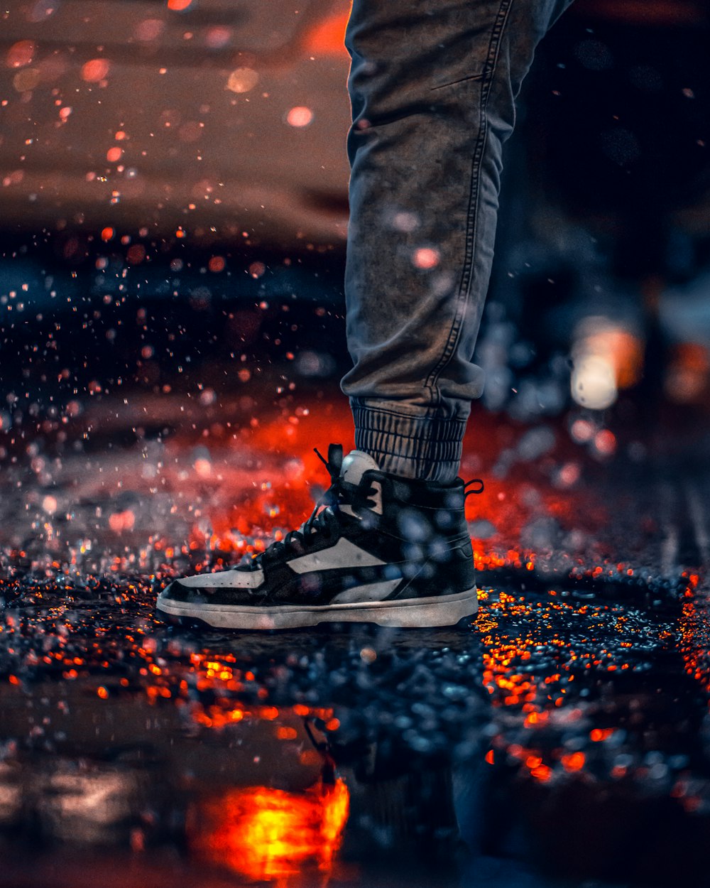 a person standing on top of a puddle of water