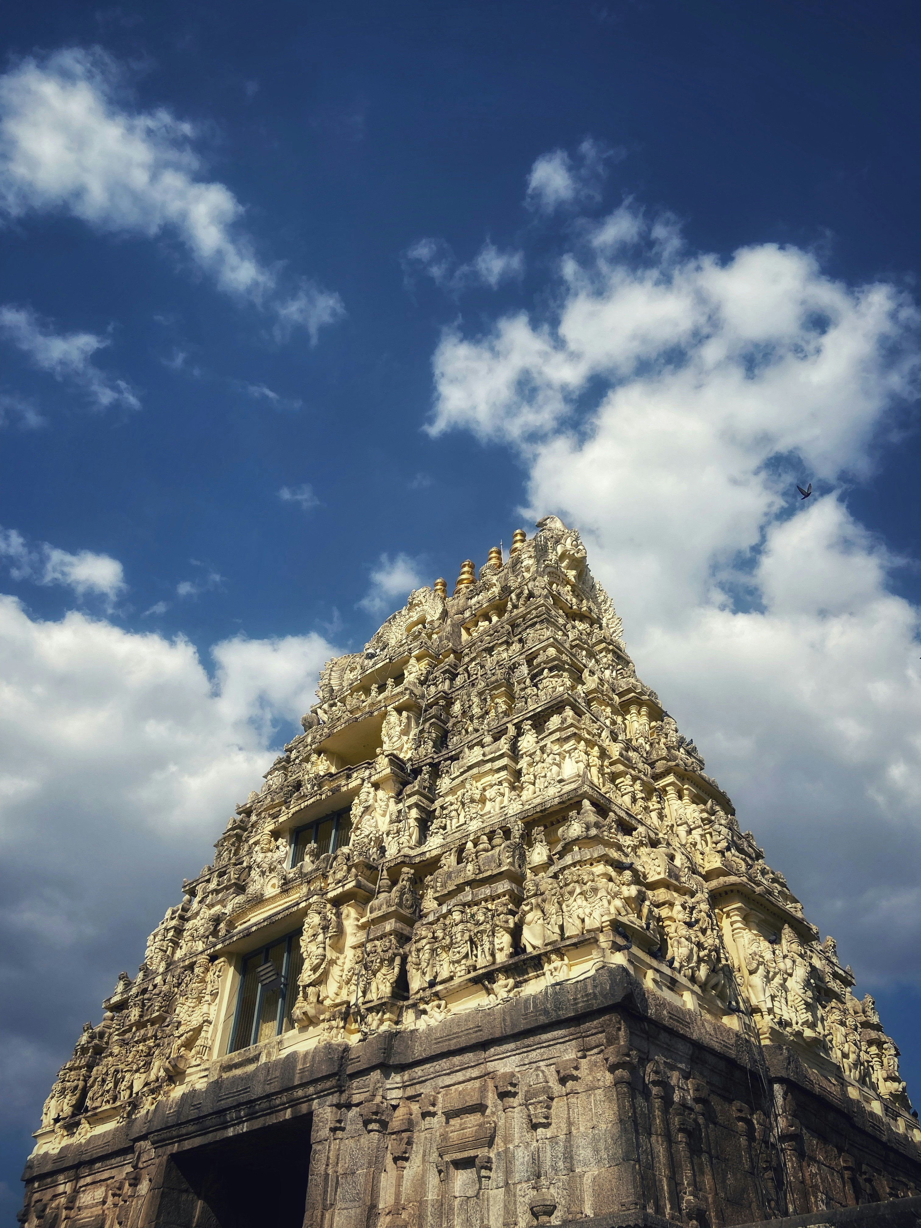 a very tall tower with a sky in the background