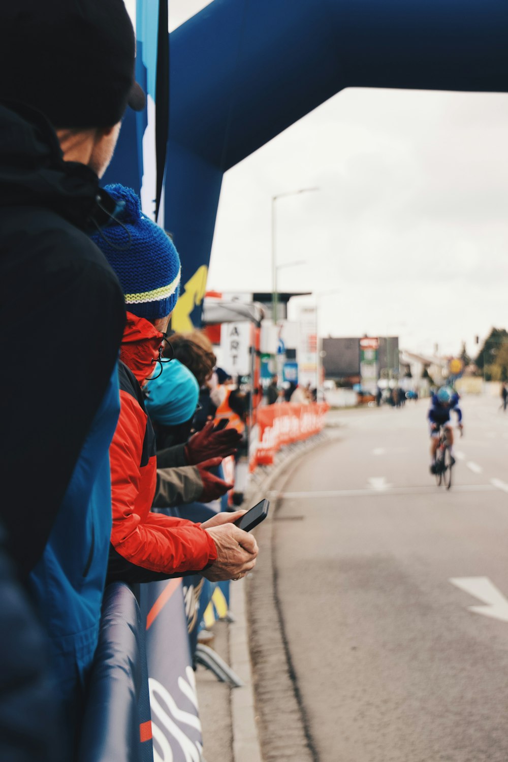 a group of people riding bikes down a street