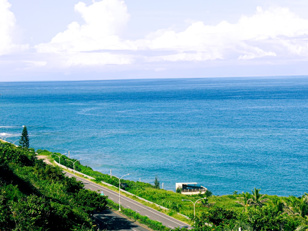 a scenic view of the ocean from a hill