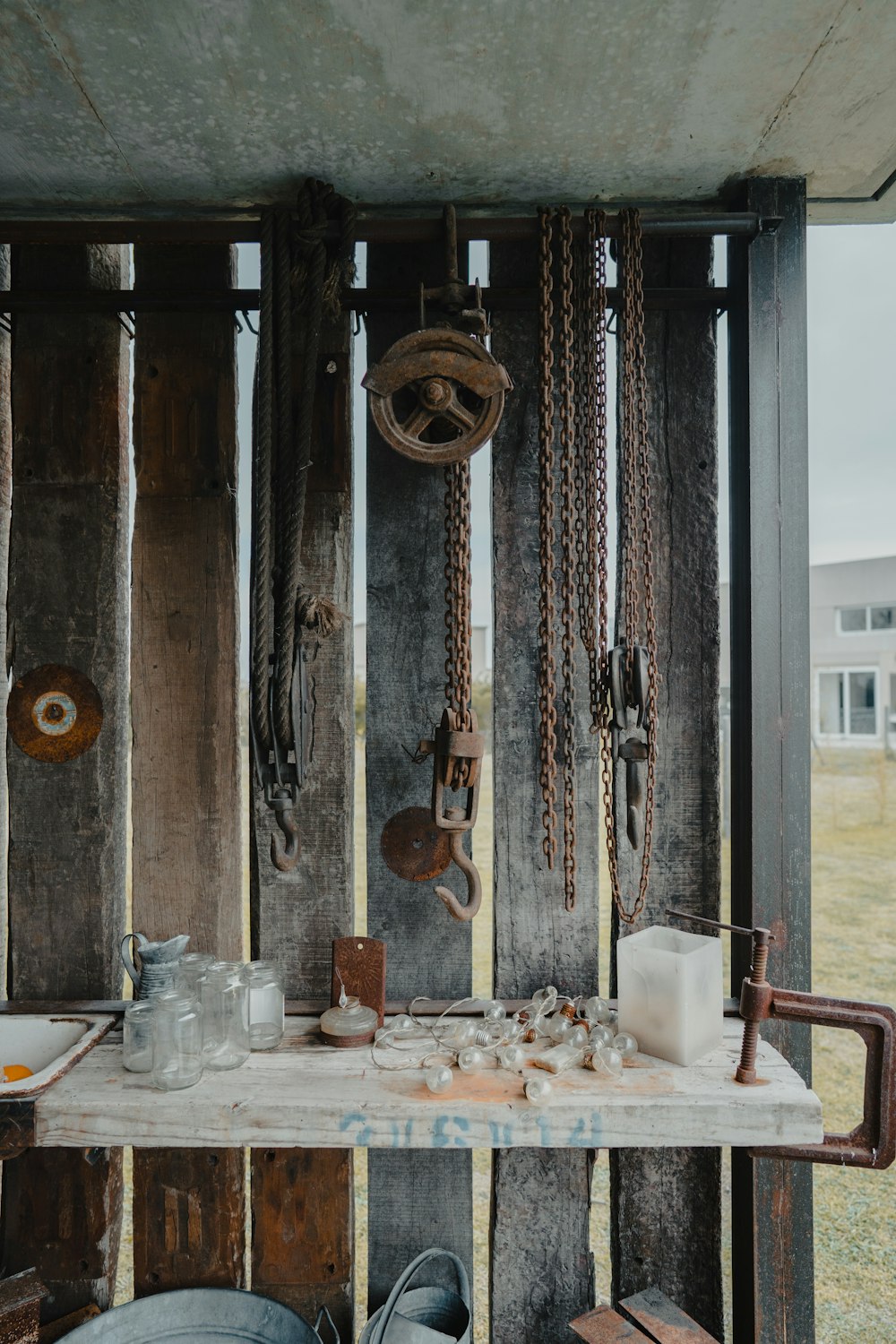 a wooden table topped with lots of junk