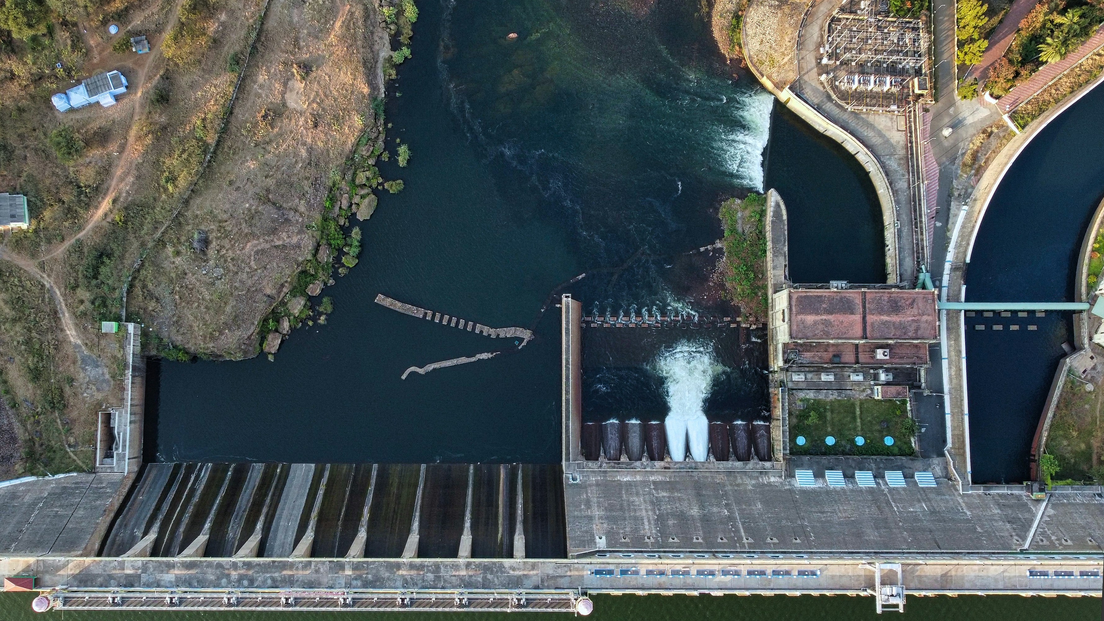 an aerial view of a dam on a river