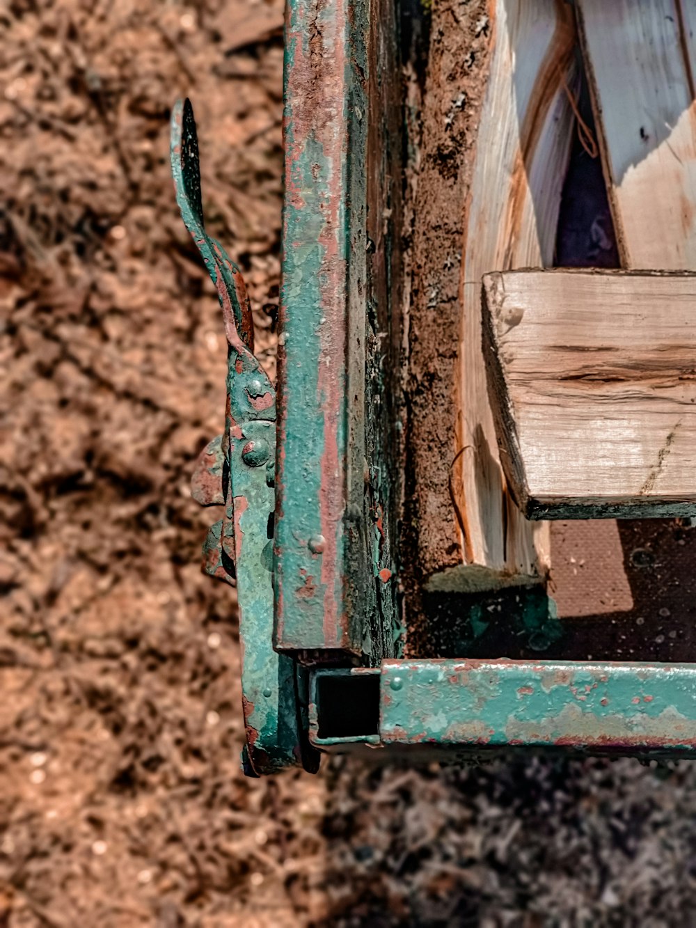 a piece of wood sitting on top of a green truck