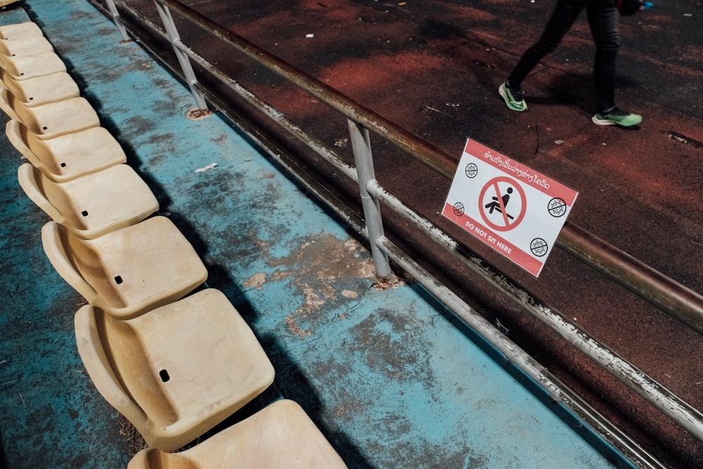 a row of seats sitting on top of a wooden floor