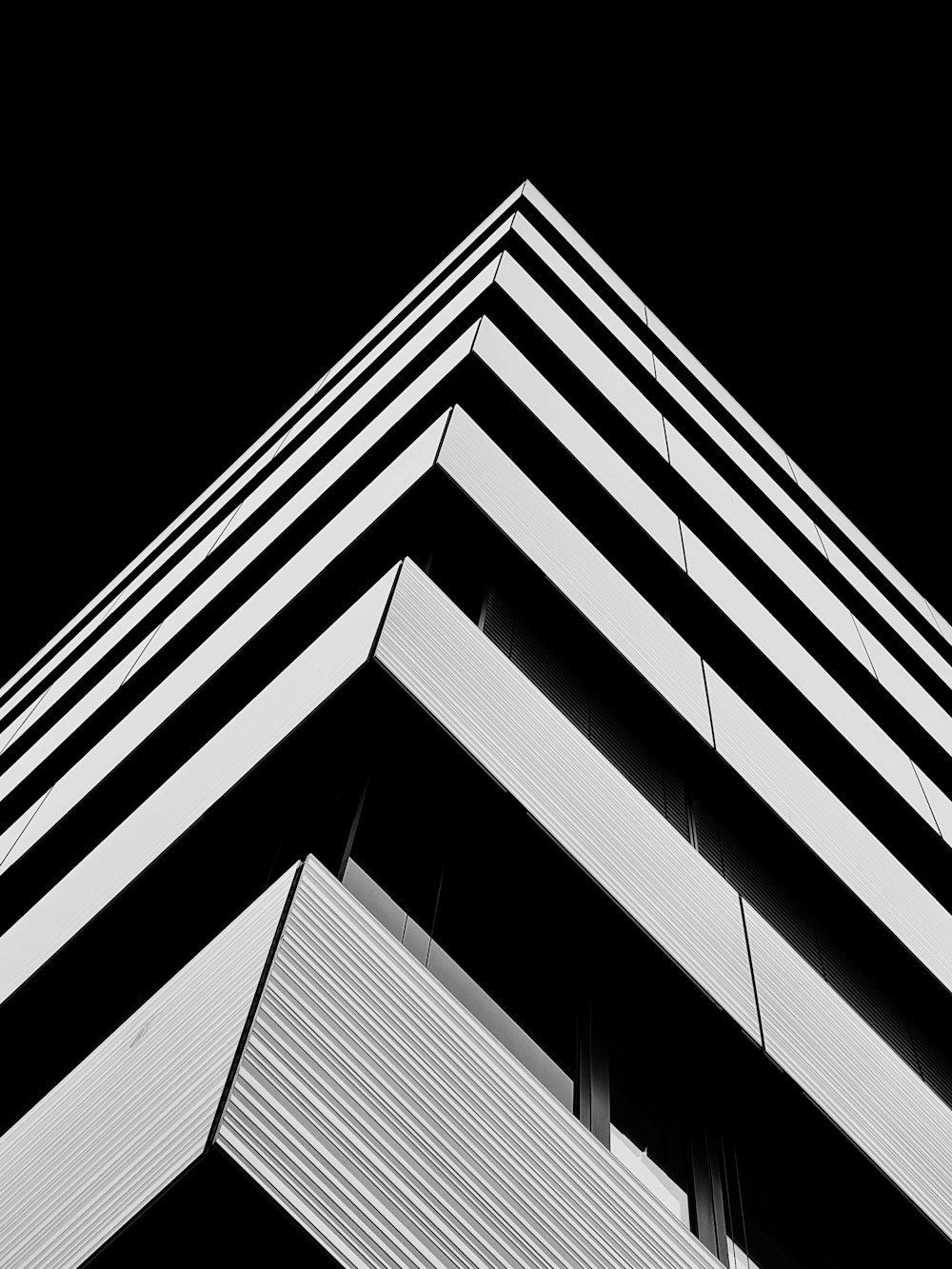 a black and white photo of a tall building