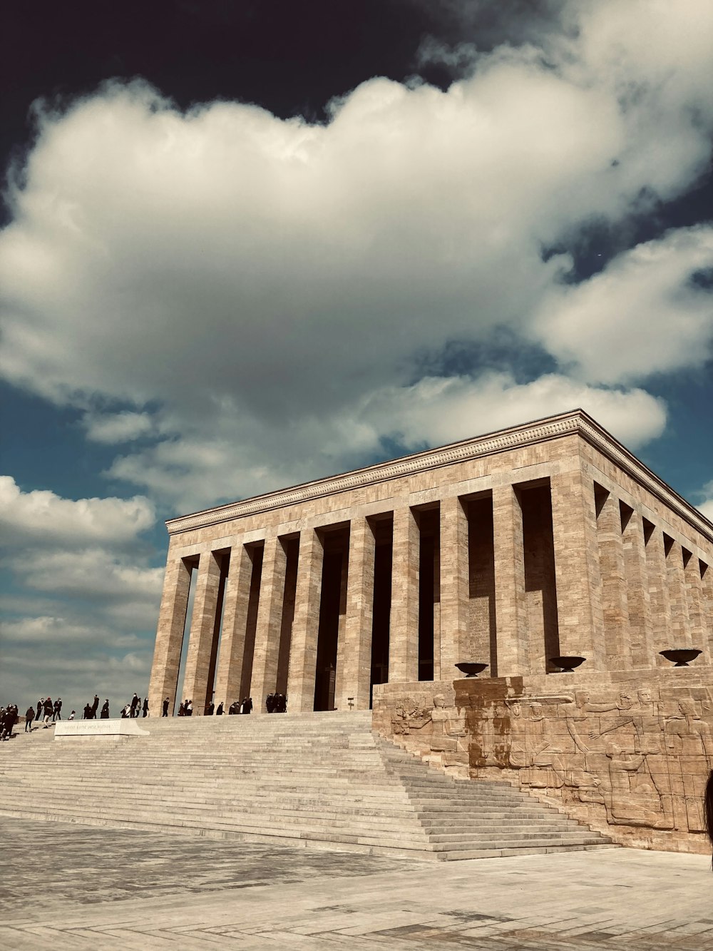 a large stone building with columns on the side of it