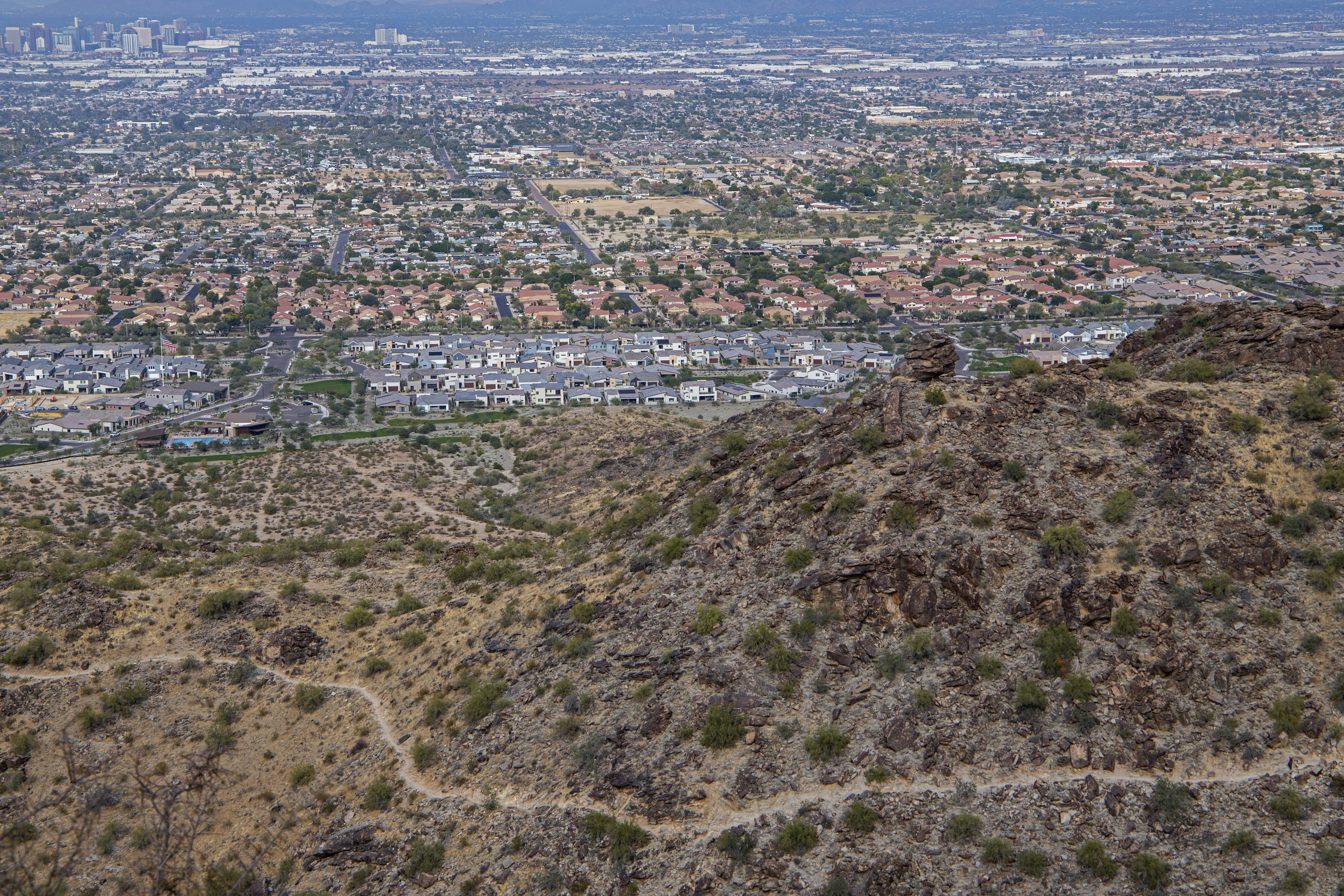 An aerial view of a city from a hill