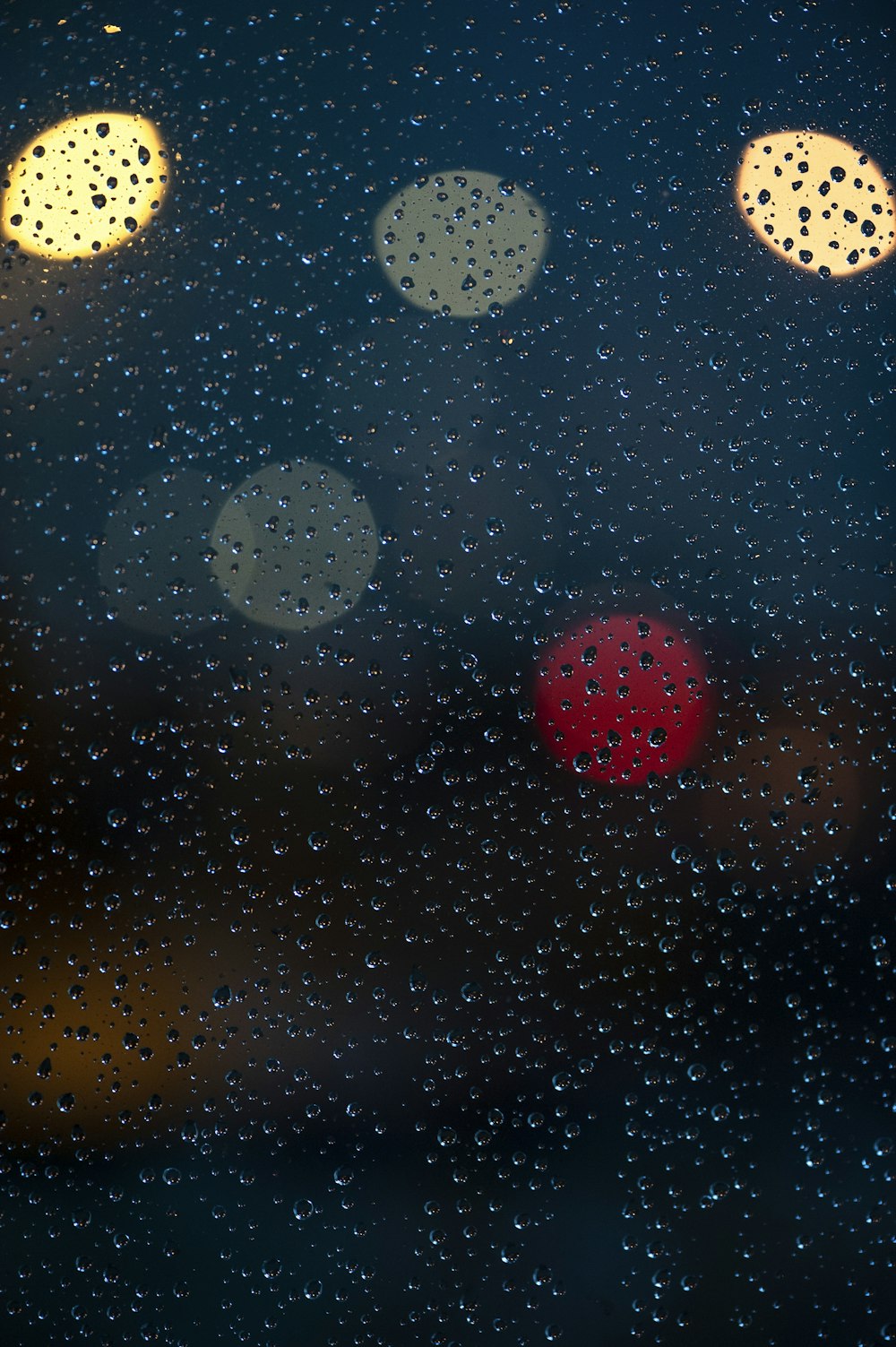 a close up of a window with rain drops