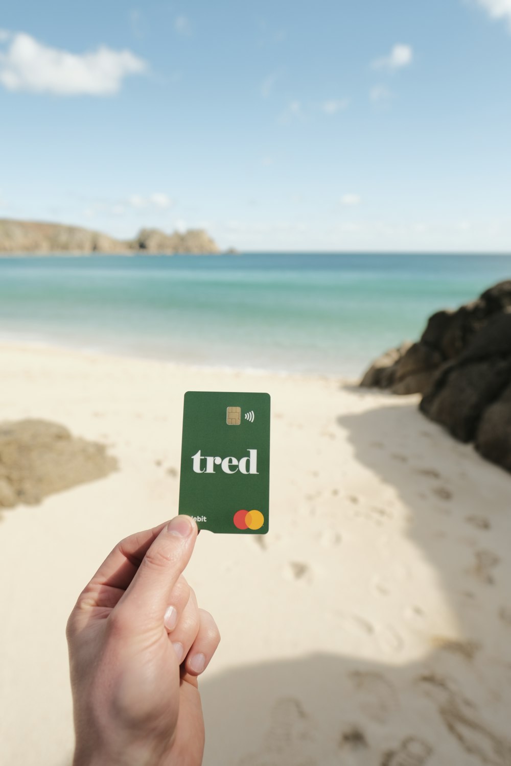 a person holding up a card with the word ted on it