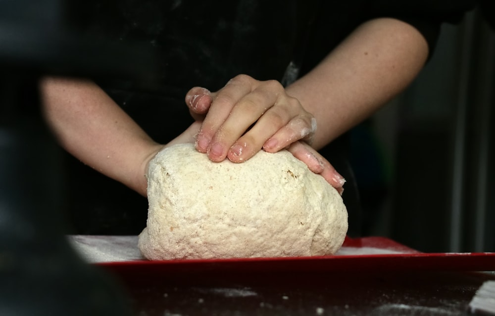 a person cutting a piece of food