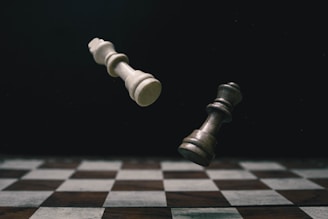 a black and white checkered chess board with a white pawn