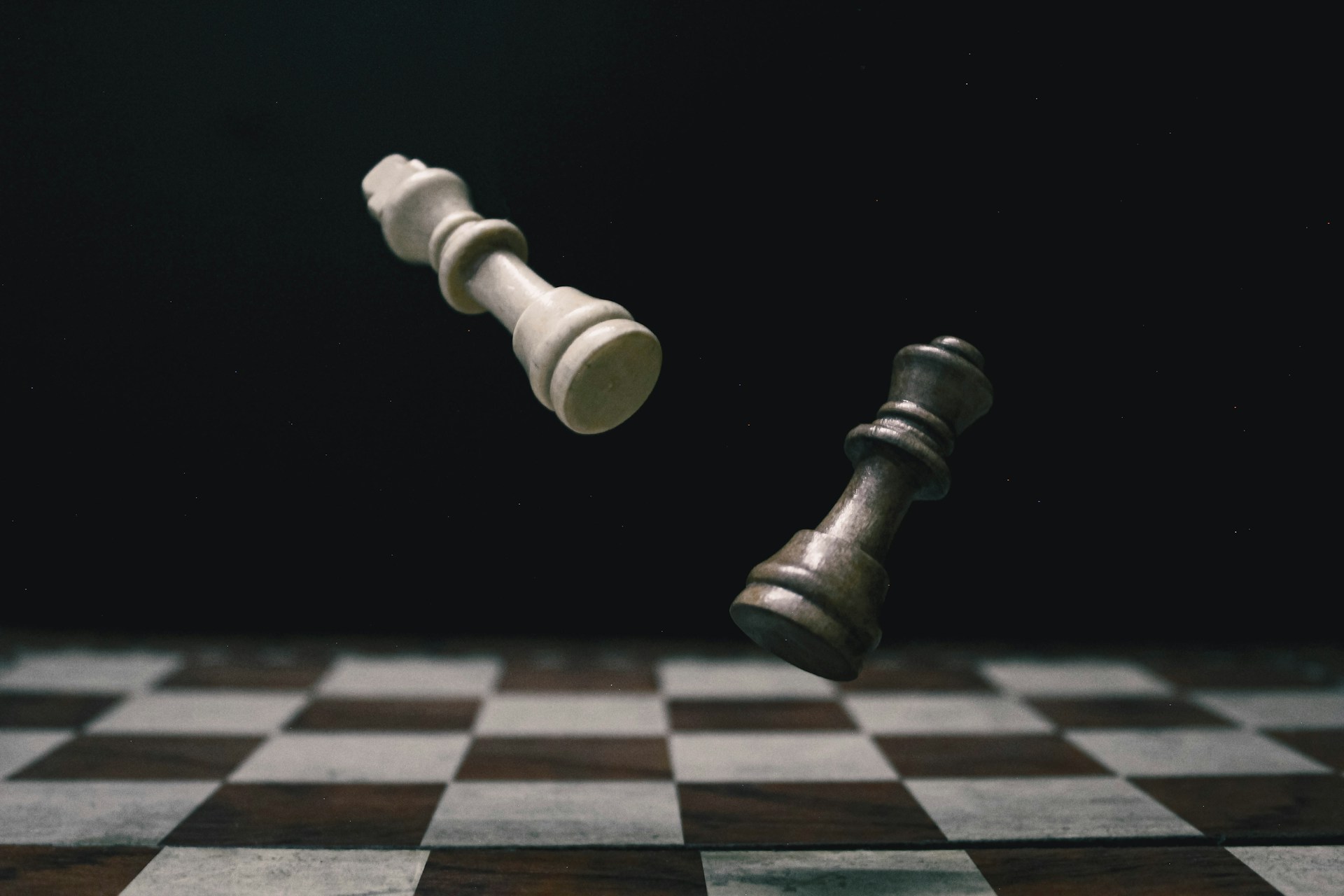 a black and white checkered chess board with a white pawn