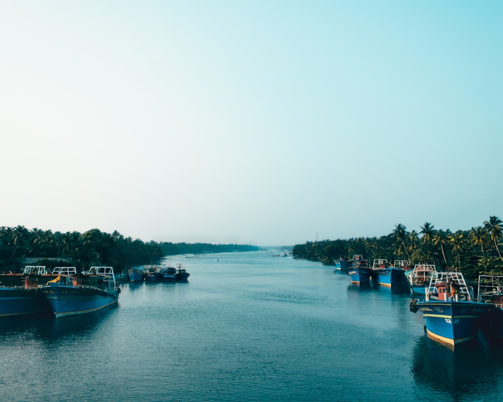 a group of boats that are sitting in the water