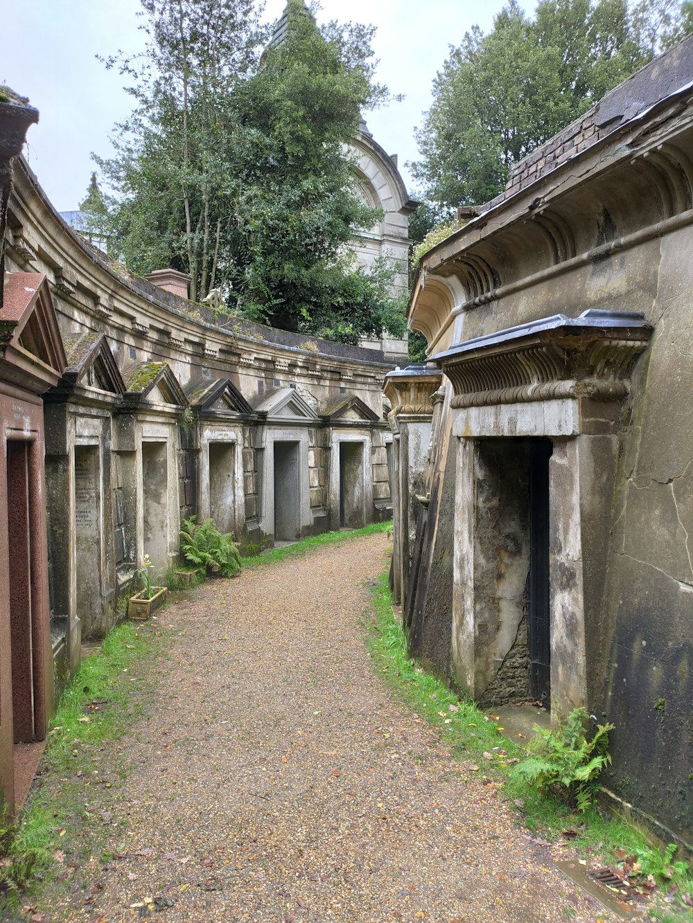 an old cemetery with a dirt path leading to it