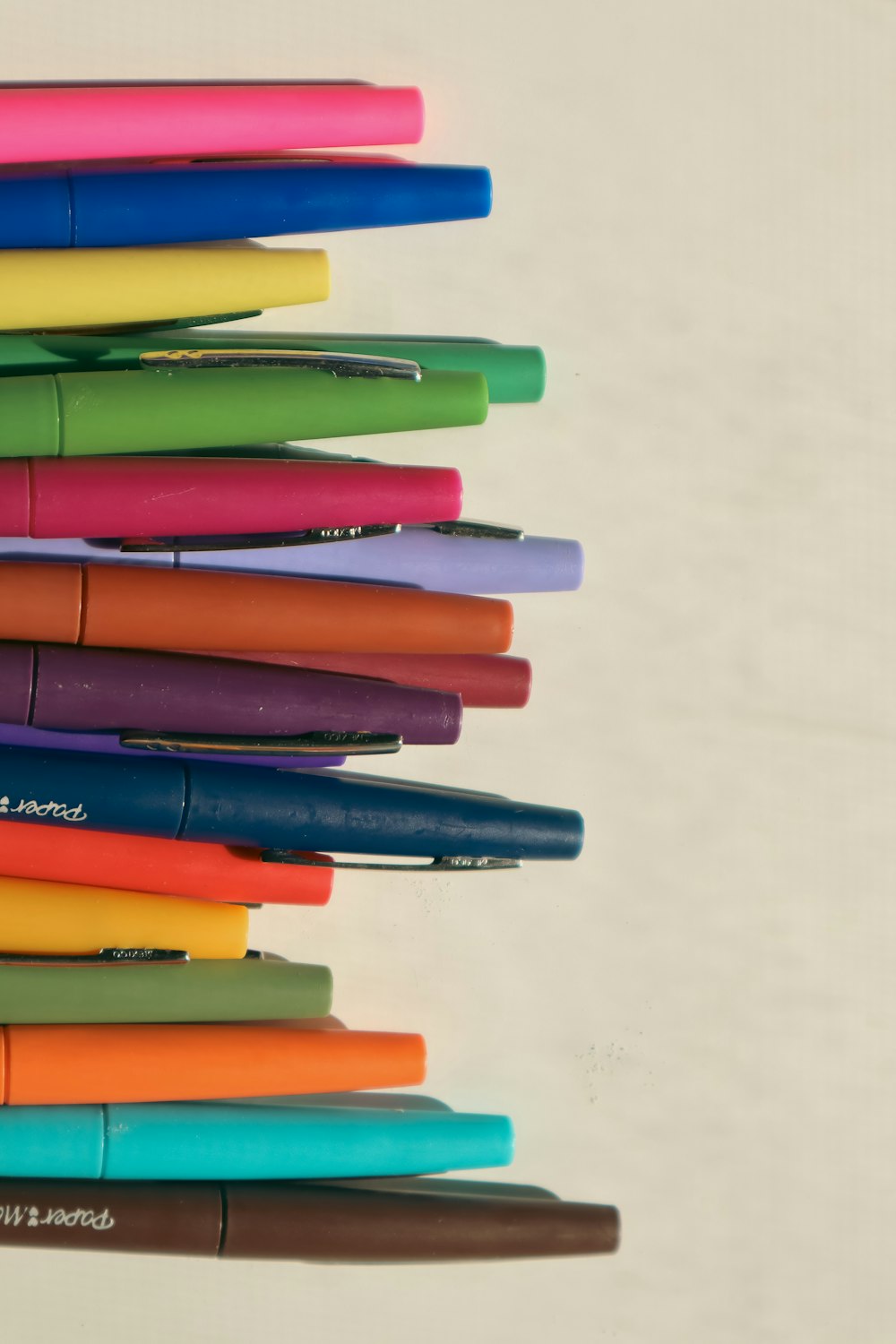 a stack of pens sitting on top of each other