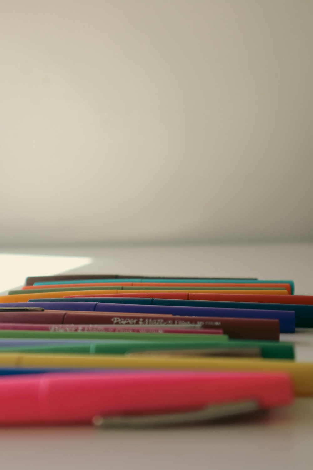 a group of pens sitting on top of a table