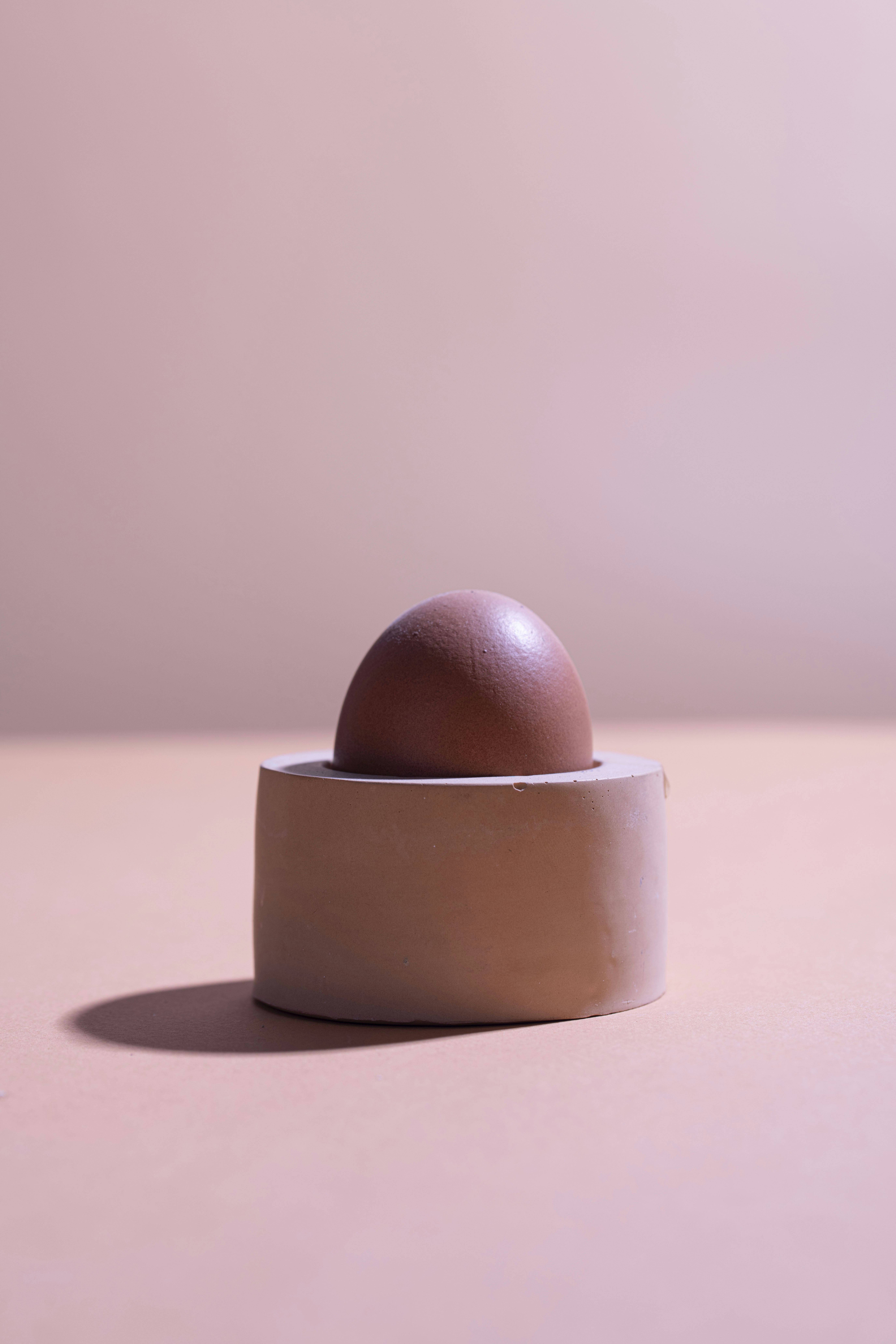 an egg sitting in a bowl on a table