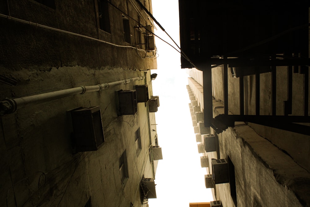 a narrow alley way with a fire hydrant in the distance