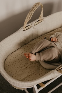 a baby laying in a crib