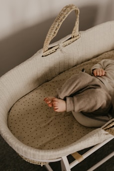 a baby laying in a crib