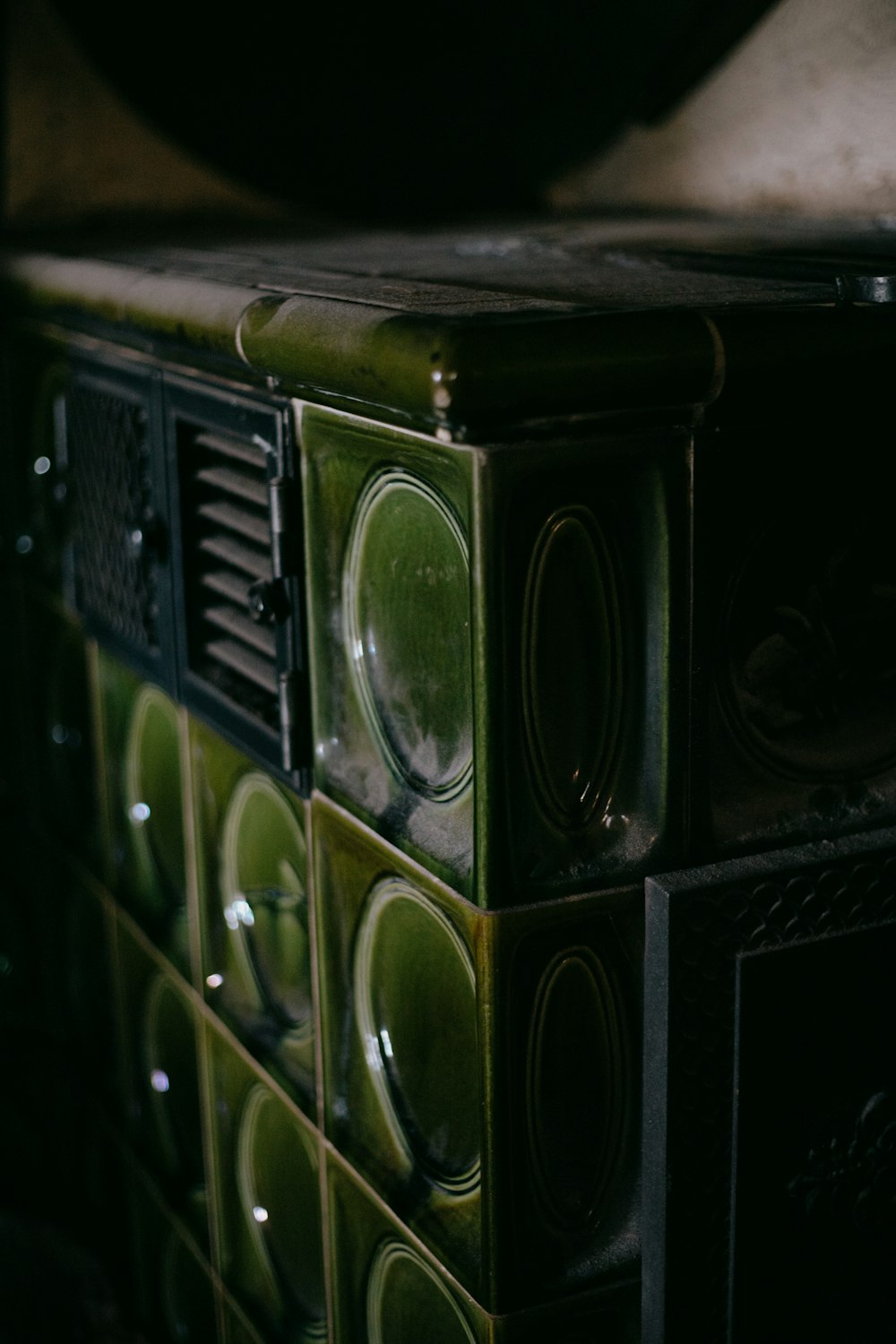a close up of a green and black cabinet