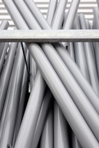 a bunch of metal pipes are stacked together