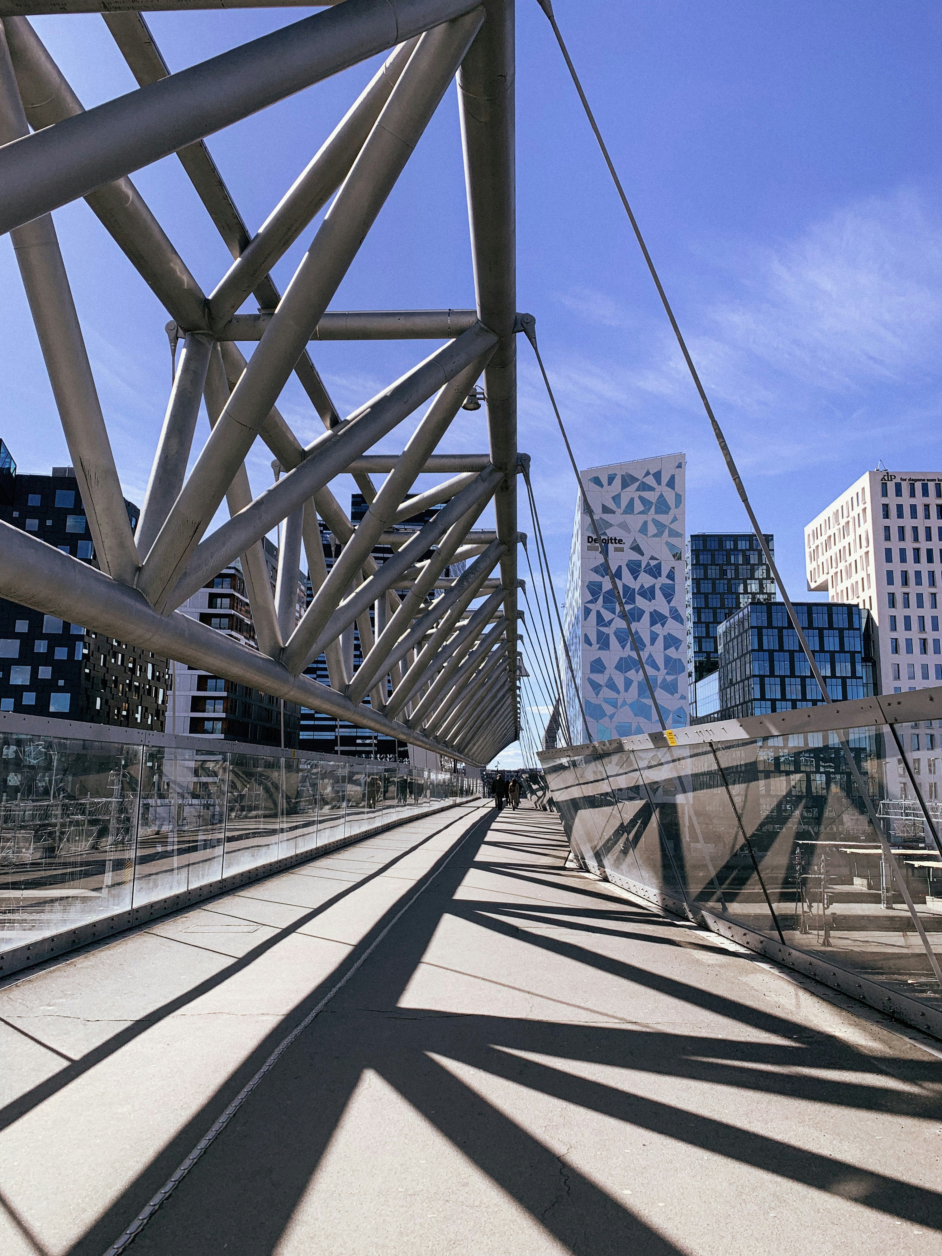 a view of a bridge with buildings in the background