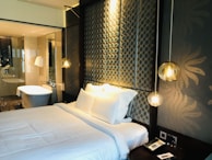 A sophisticated bedroom featuring clean lines and luxurious decor.