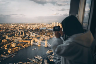 a person taking a picture of a city
