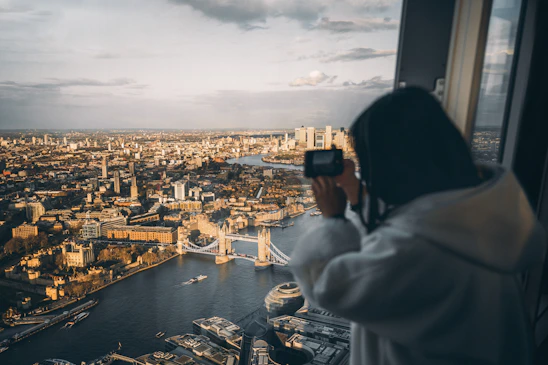 a person taking a picture of a city