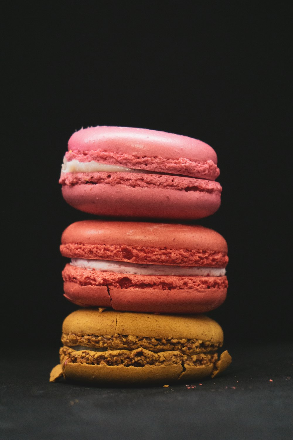 a stack of three macaroons sitting on top of each other
