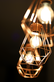 A close-up of modern LED frames glowing softly on a wall in a stylish living room.