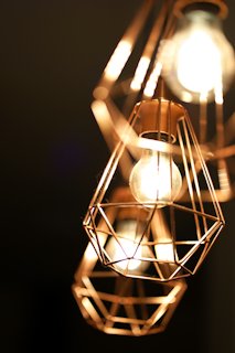 Dynamic photo of bright LED lighting fixtures glowing warmly.