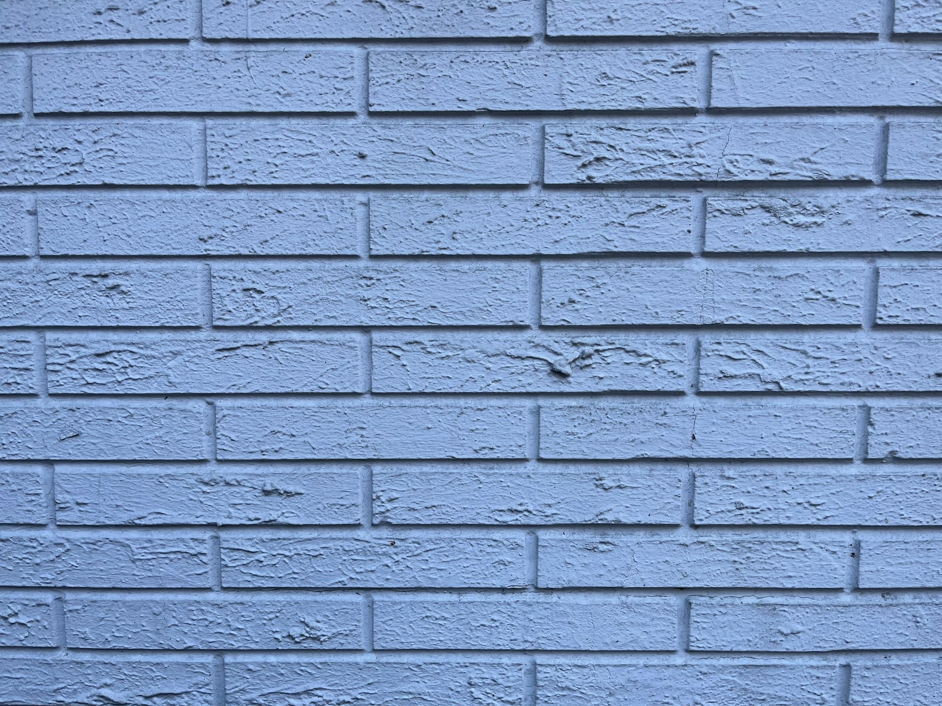 a close up of a blue brick wall