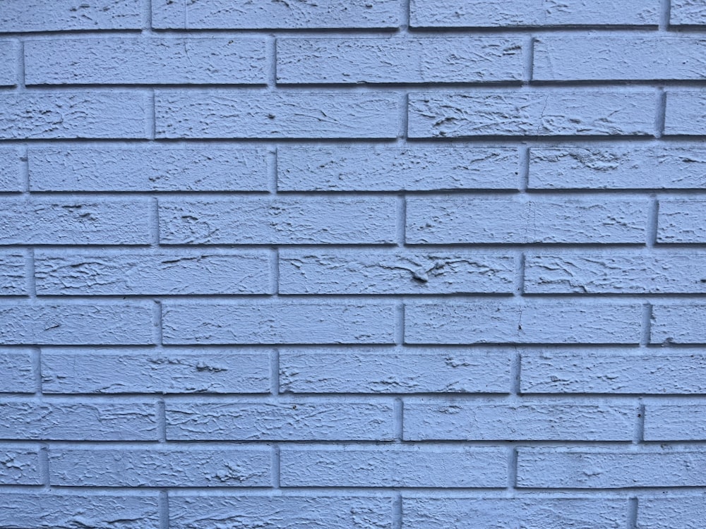 a close up of a blue brick wall