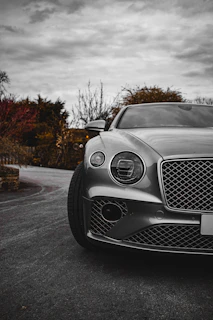 a silver car parked on the side of a road