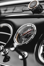 a close up of a car dashboard with a clock