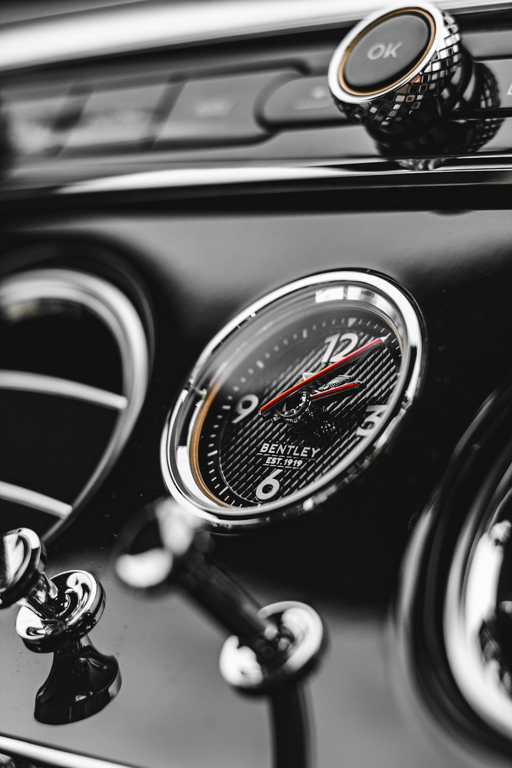 a close up of a car dashboard with a clock