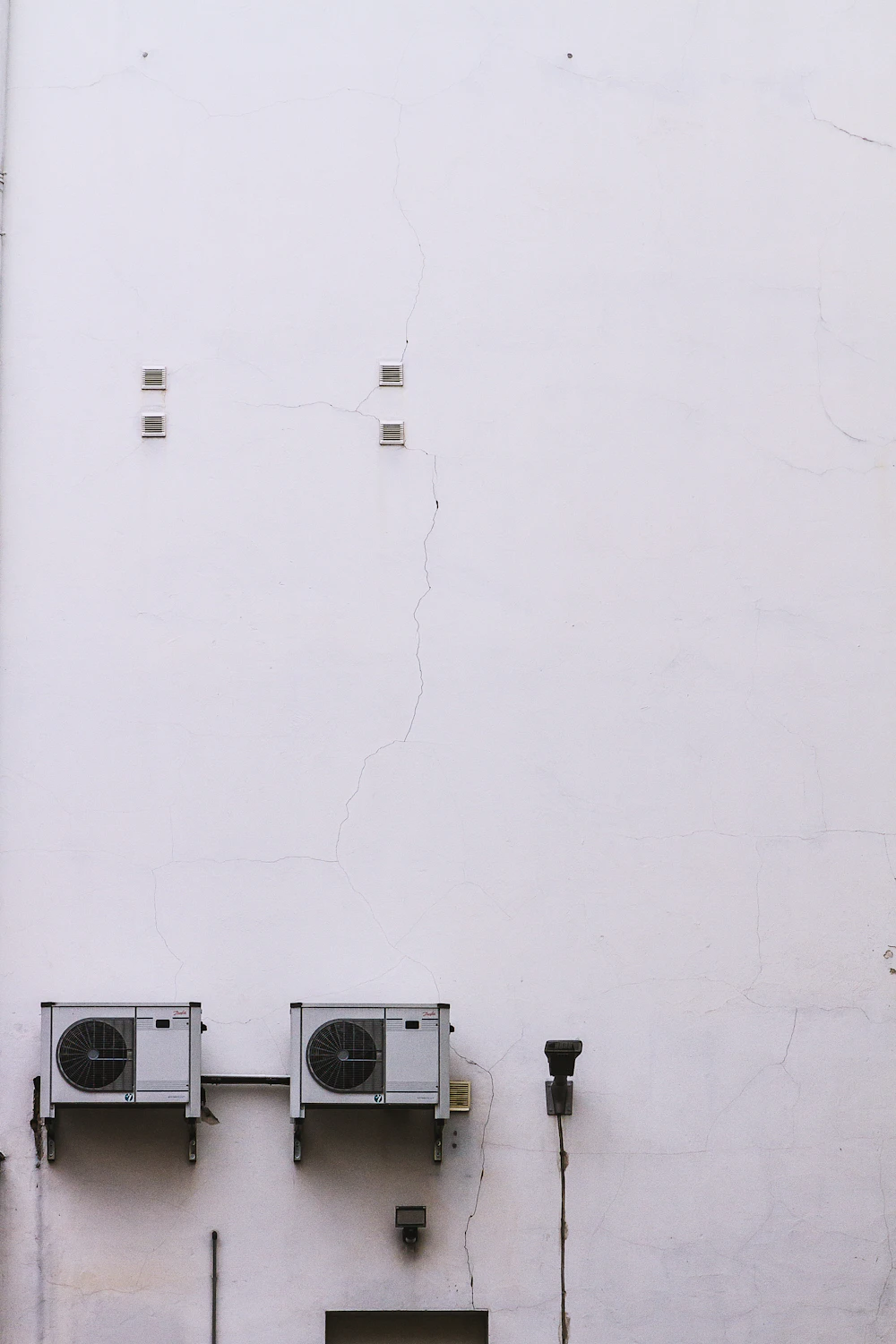 Indoor AC units mounted on a wall in an Abu Dhabi home