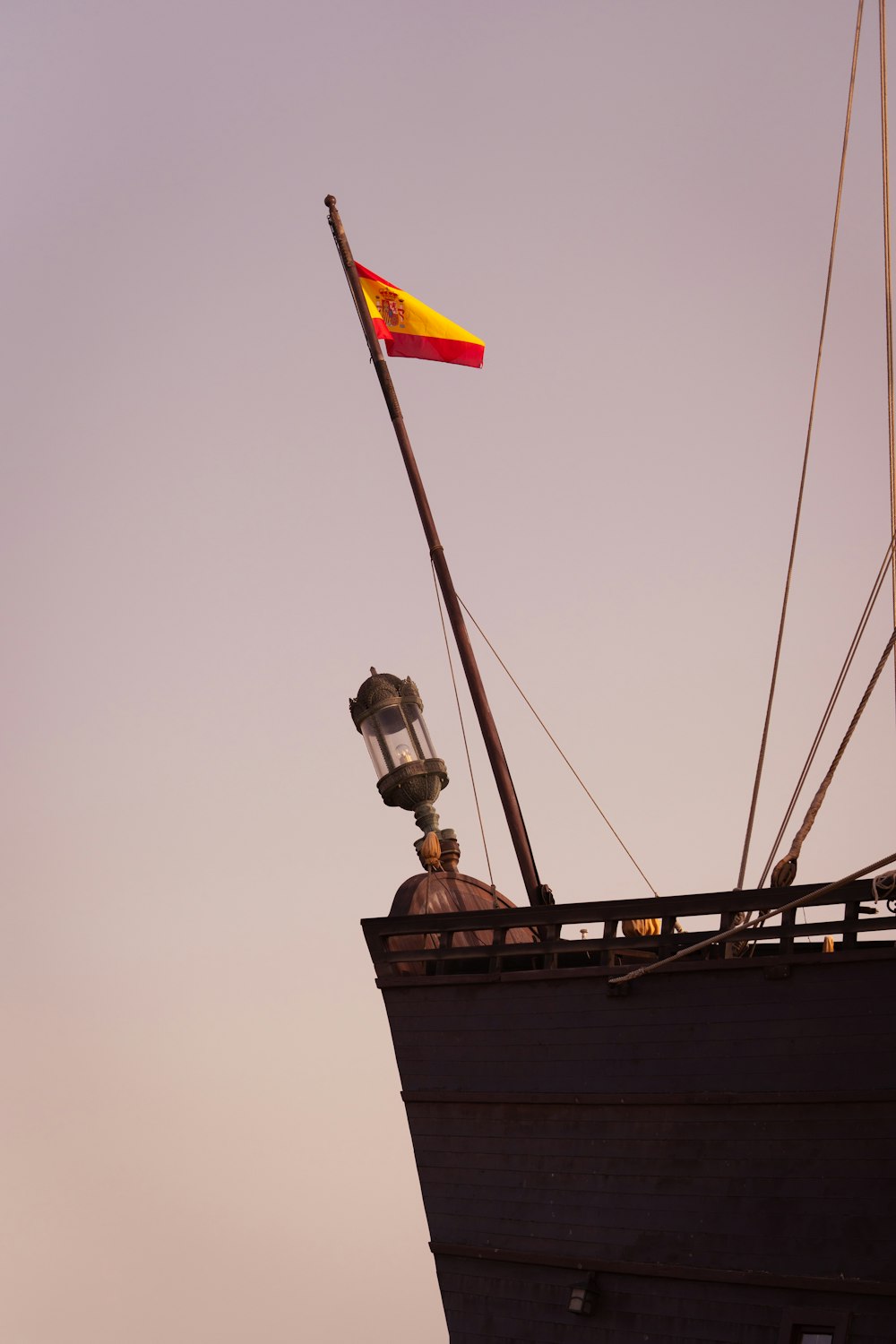 a boat with a flag on top of it