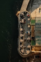A cozy riverside café bustling with visitors sipping coffee and enjoying the view.