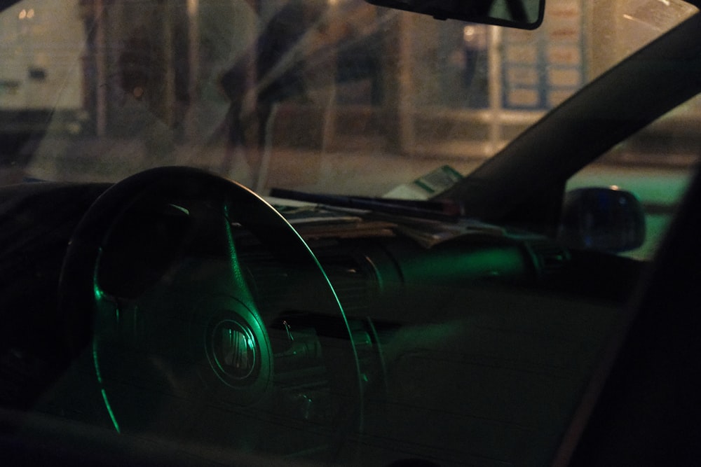 the interior of a car with a green light