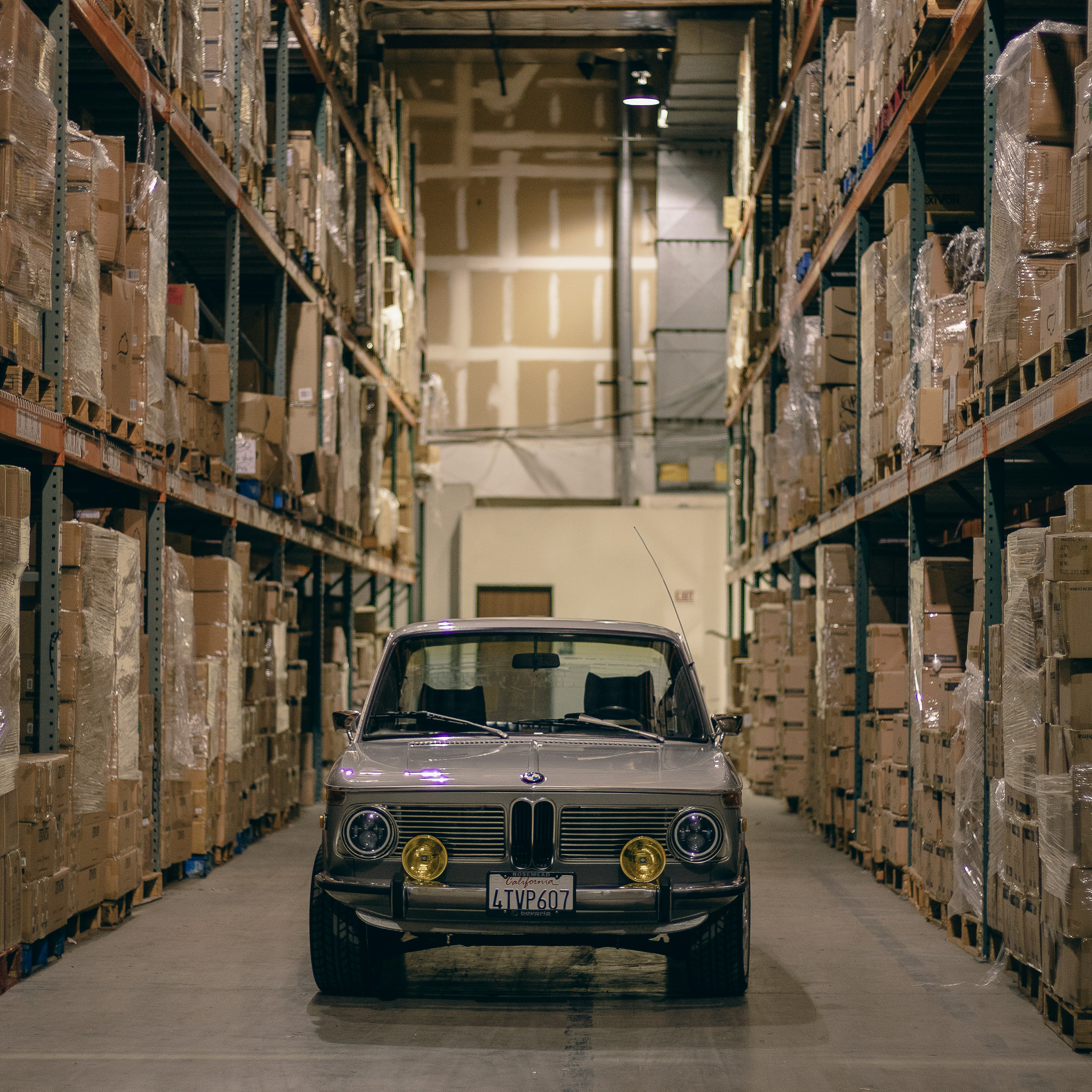 Vehicle in parts warehouse with shelves
